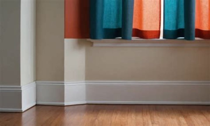 Can curtains hang above baseboards?