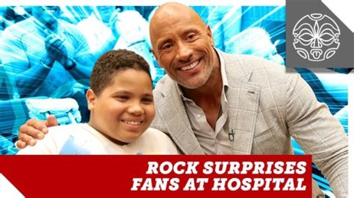 The Rock surprises an LA tour bus in his neighborhood, thrills fans