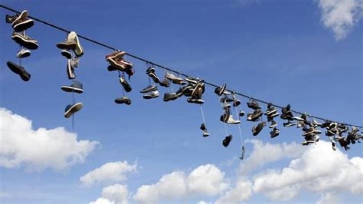What does shoes hanging on a wire mean?